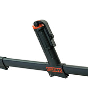 A close-up of a black and orange Quest metal detector mount with a phone holder attachment closed, shown on a white background.