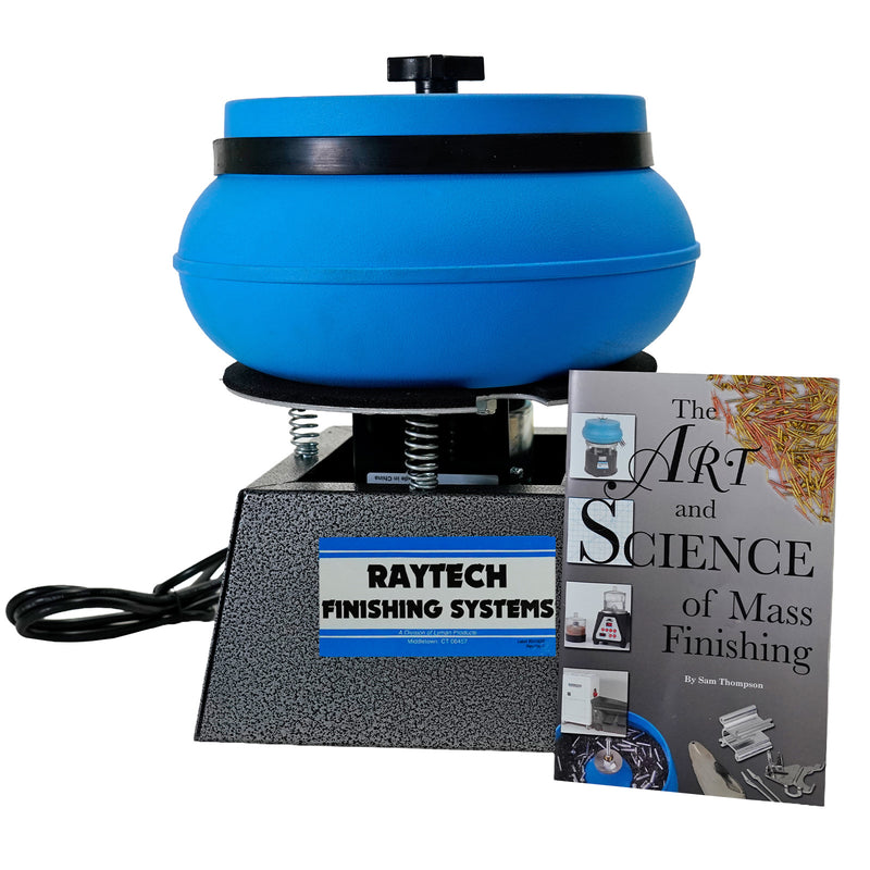 A Raytech mass finisher machine with a blue rotating bowl and a textured gray base, shown alongside a book titled 'The Art and Science of Mass Finishing' by Sam Thompson on a white background.