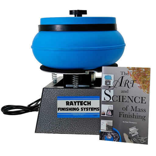 A Raytech mass finisher machine with a blue rotating bowl and a textured gray base, shown alongside a book titled 'The Art and Science of Mass Finishing' by Sam Thompson on a white background.