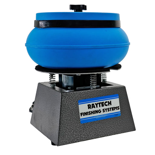 A Raytech Finishing Systems machine with a blue circular abrasive head mounted on a textured gray base, shown against a plain white background.