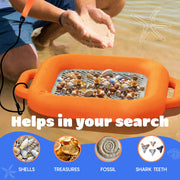 An orange handheld seashell and shell specimen finder with a metal mesh floating sifter is shown in shallow water with a person's hands above it, plus text reading 'Helps in your search' and icons for shells, treasures, fossil, and shark teeth.