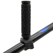 Black textured grip on a pull handle with blue branding logo.