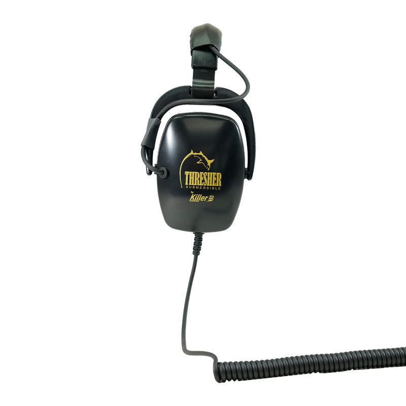 Black headphones positioned to the side with yellow "Killer B Thresher SUBMERSIBLE" writing in yellow with black coiled cord with white background